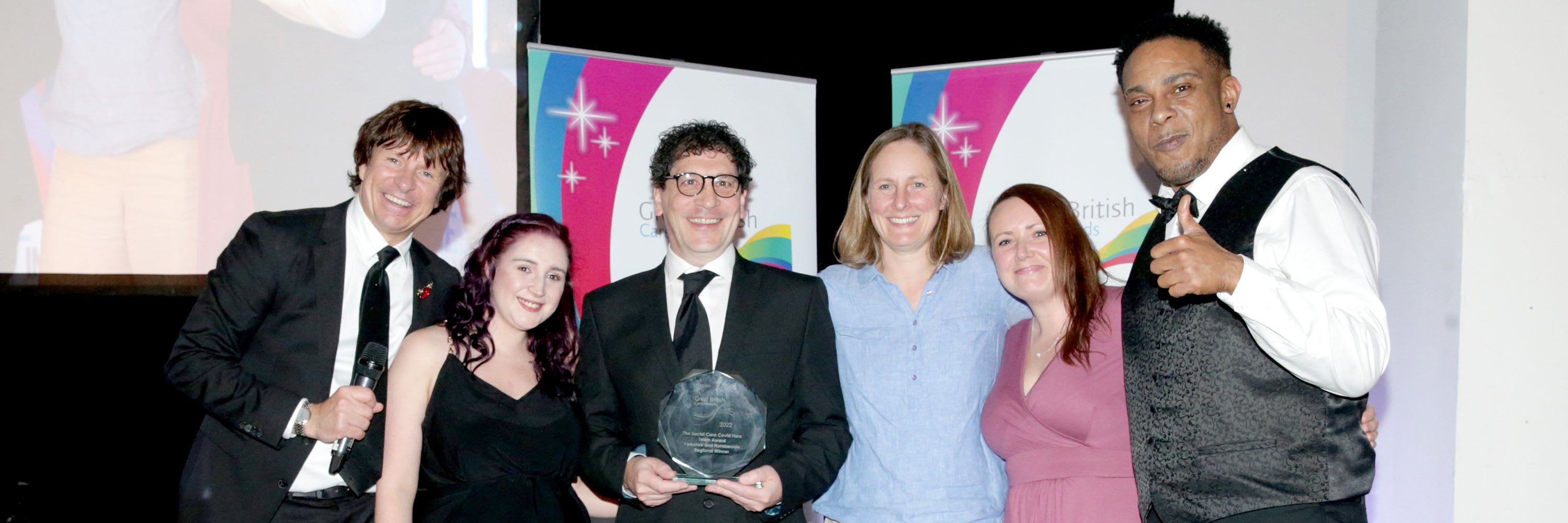 Leeds Autism Services team members being awarded with 2022's Covid Heroes Team Award at the Great British Care Awards